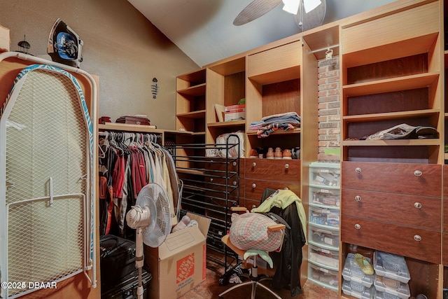 spacious closet featuring lofted ceiling and ceiling fan