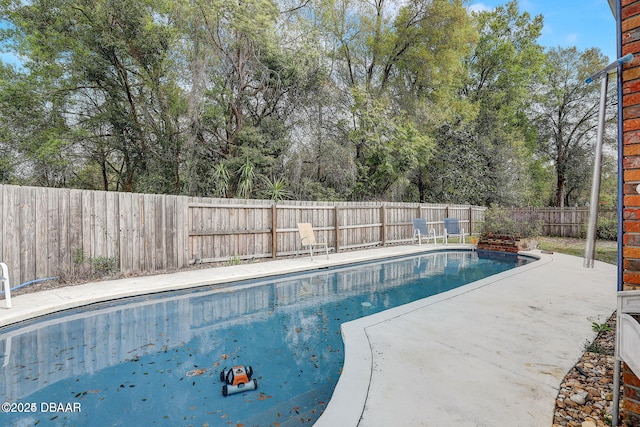 view of pool featuring a patio area, a fenced backyard, and a fenced in pool