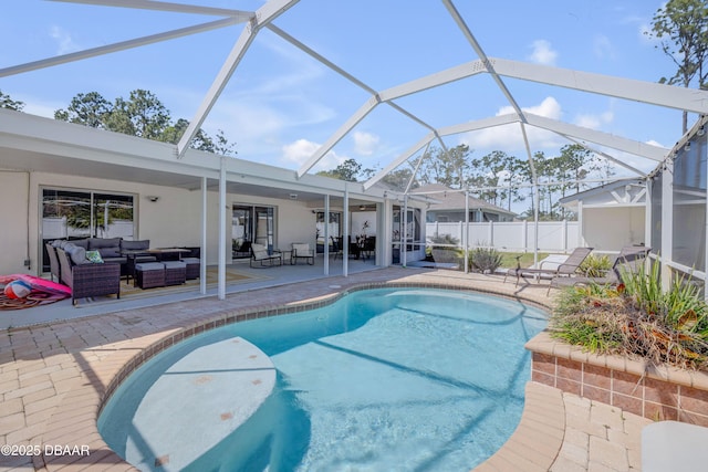 view of pool with an outdoor living space, a fenced in pool, fence, a lanai, and a patio area