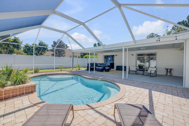 view of swimming pool featuring a patio area, an outdoor hangout area, a fenced in pool, and fence