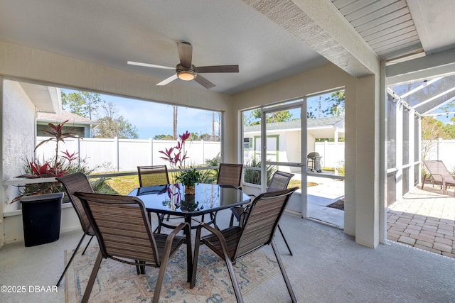 sunroom featuring plenty of natural light and ceiling fan