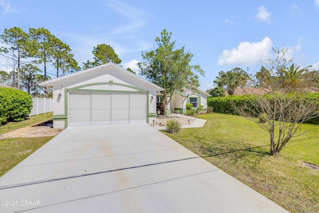 view of front facade featuring a garage, driveway, a front yard, and fence