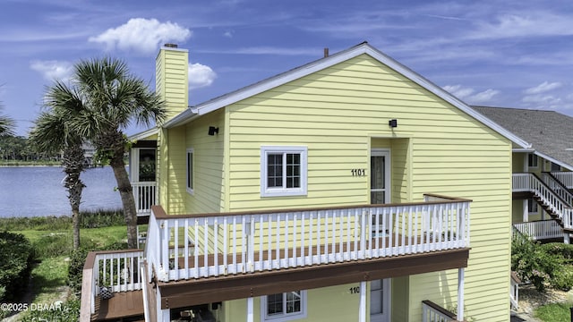 1101 Ocean Marina Dr Unit 201, Flagler Beach, FL 32136 - rear view of house featuring a water view and a chimney
