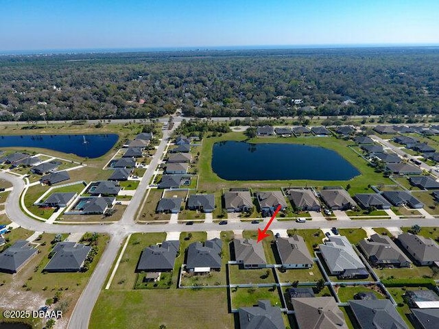 birds eye view of property with a residential view and a water view