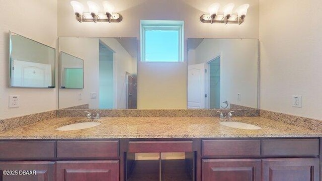 bathroom featuring double vanity and a sink