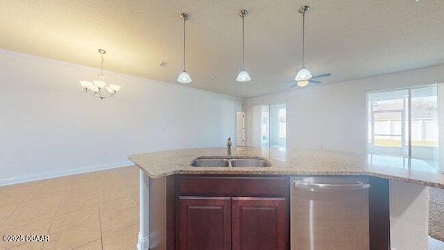 kitchen with a sink, hanging light fixtures, stainless steel dishwasher, and light stone countertops