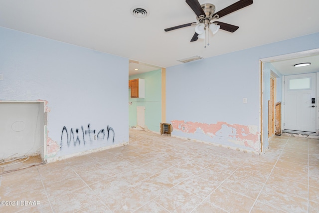 spare room with light tile patterned floors and ceiling fan