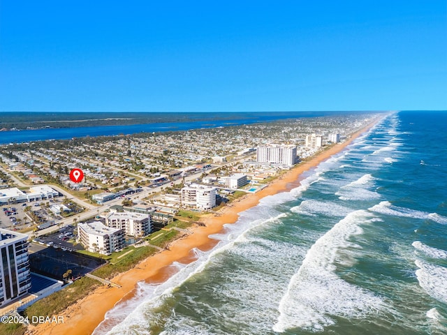 birds eye view of property featuring a view of the beach and a water view