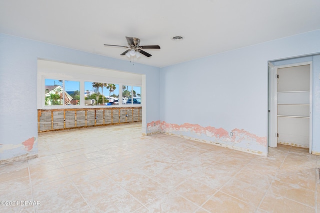 spare room with ceiling fan