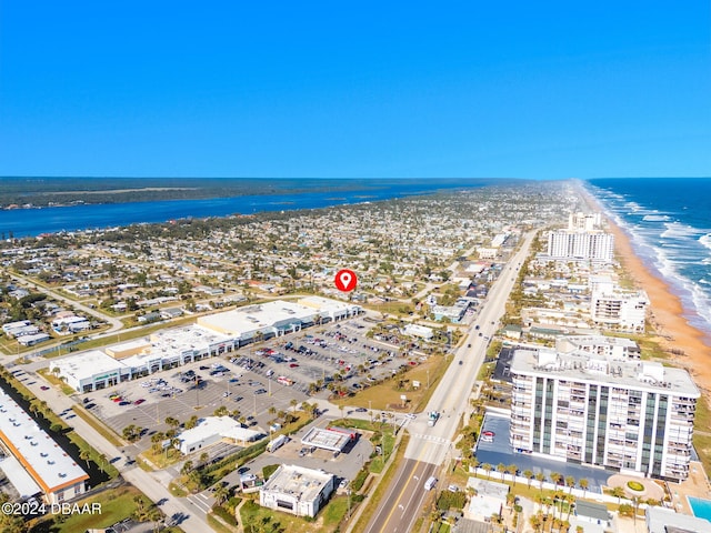 aerial view featuring a water view and a beach view