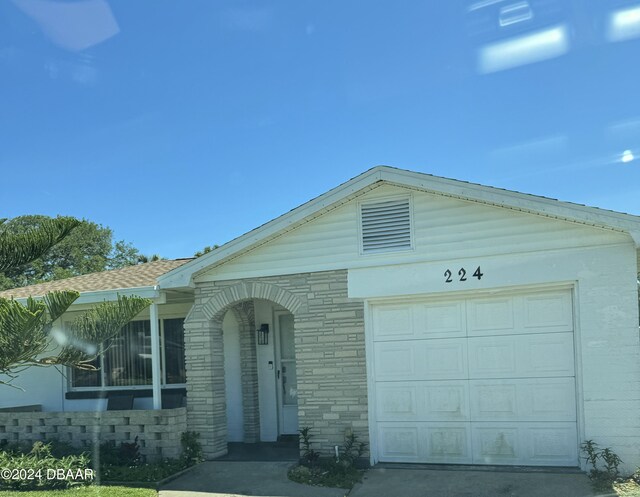 ranch-style house featuring a garage