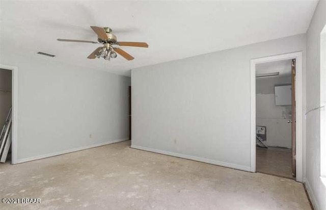 21305 86th Ave, Micanopy, FL 32667 - unfurnished bedroom featuring baseboards and a ceiling fan