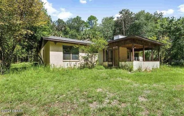 21305 86th Ave, Micanopy, FL 32667 - rear view of house featuring stucco siding