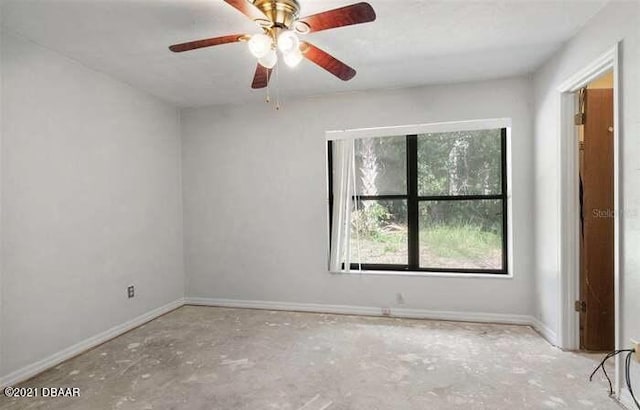 21305 86th Ave, Micanopy, FL 32667 - spare room featuring baseboards and ceiling fan