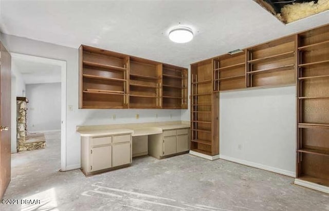 21305 86th Ave, Micanopy, FL 32667 - unfurnished office featuring baseboards and built in study area