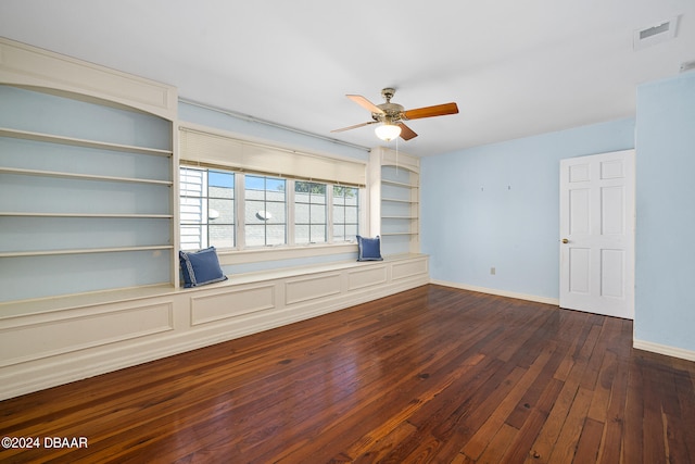 unfurnished room with ceiling fan and dark hardwood / wood-style floors