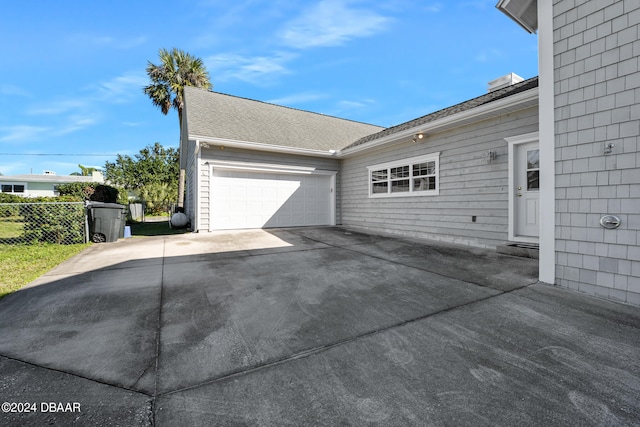 view of property exterior featuring a garage