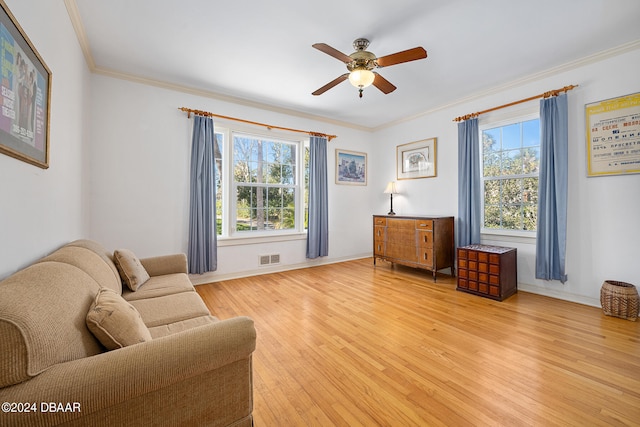 sitting room featuring light hardwood / wood-style floors, ceiling fan, and ornamental molding