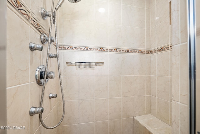 bathroom with tiled shower