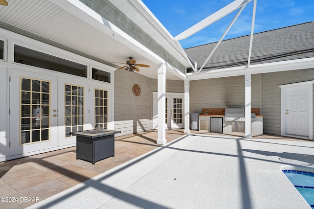 view of patio / terrace featuring french doors, a lanai, and ceiling fan