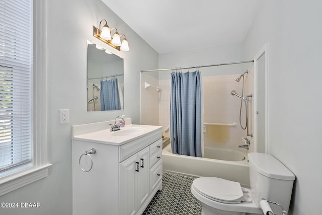 full bathroom with tile patterned flooring, vanity, shower / bathtub combination with curtain, and toilet