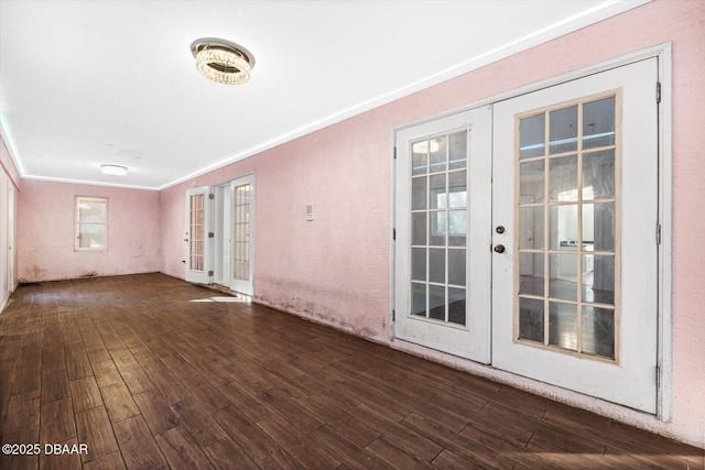 empty room with french doors and ornamental molding