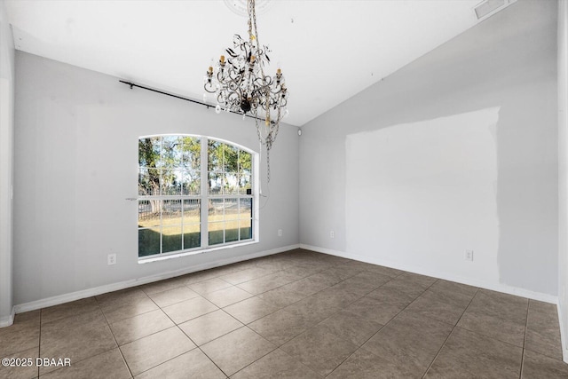 unfurnished dining area with tile patterned floors, a chandelier, and lofted ceiling