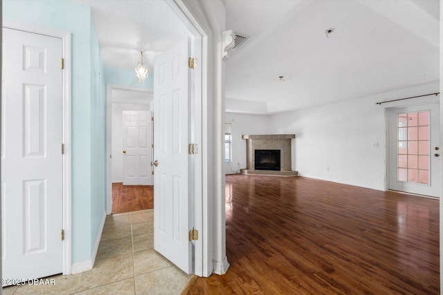 unfurnished living room featuring light tile patterned flooring