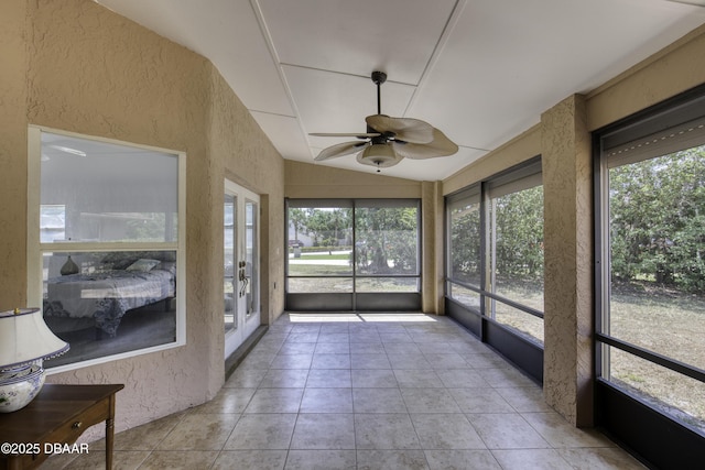 unfurnished sunroom featuring french doors and a ceiling fan