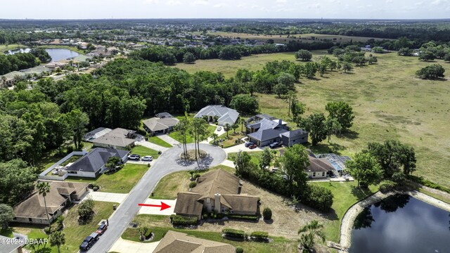 bird's eye view featuring a water view and a residential view