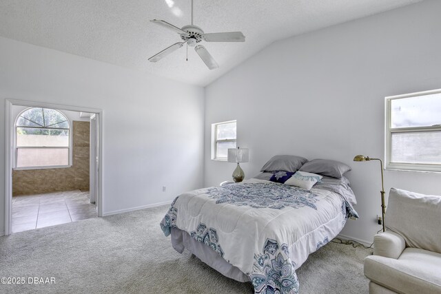 bedroom with carpet floors, a textured ceiling, baseboards, and vaulted ceiling