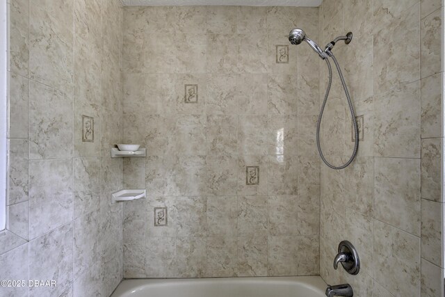 bathroom with shower / washtub combination
