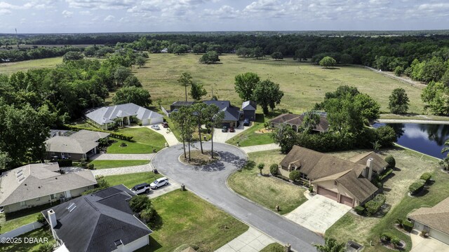 birds eye view of property featuring a water view and a residential view