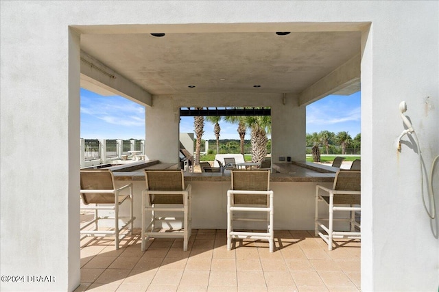 view of patio featuring exterior bar