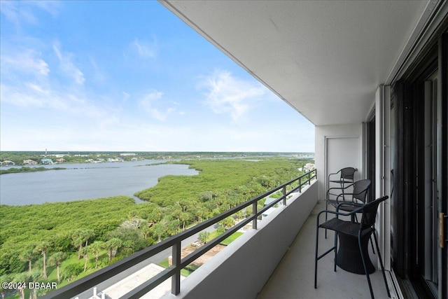 balcony featuring a water view