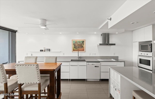 tiled living room with ceiling fan