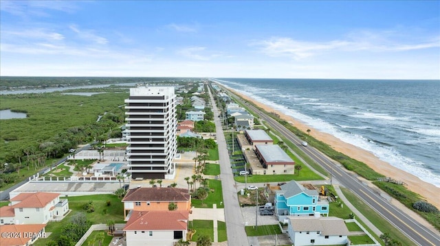 aerial view featuring a view of the beach and a water view