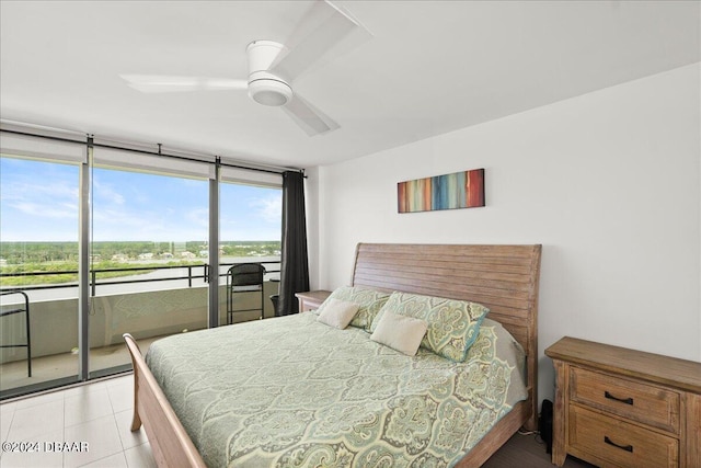 bedroom featuring ceiling fan, light tile patterned floors, and access to exterior