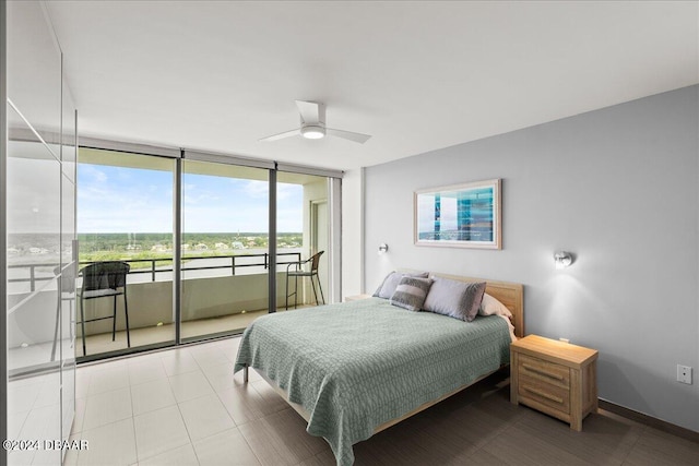 bedroom with ceiling fan, access to exterior, and a wall of windows