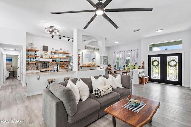 30 Bay Ct, Ormond Beach, FL 32174 - living area featuring french doors, ceiling fan, and light wood-type flooring