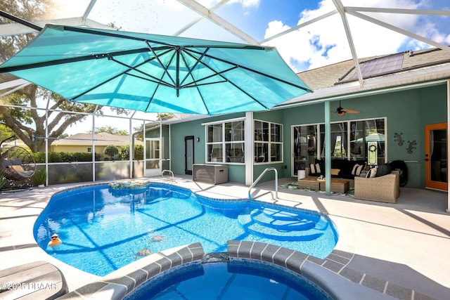 30 Bay Ct, Ormond Beach, FL 32174 - view of pool featuring a patio, glass enclosure, a ceiling fan, and a pool with connected hot tub