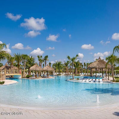 view of pool with a gazebo and pool water feature