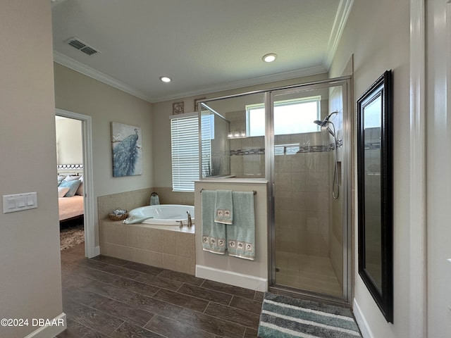 bathroom with shower with separate bathtub and crown molding