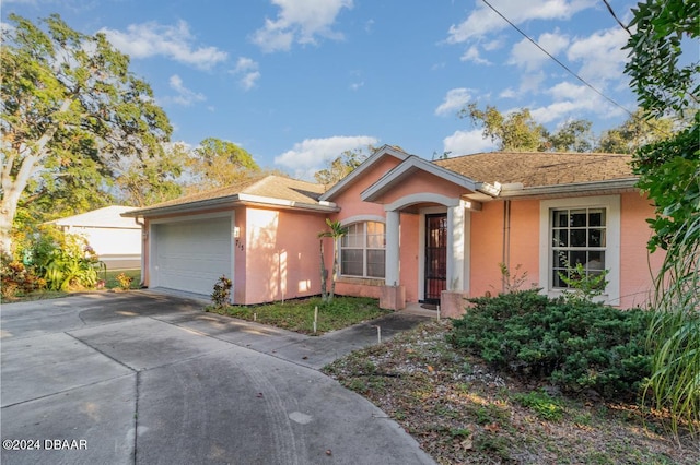 single story home with a garage