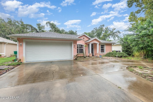 single story home with a garage