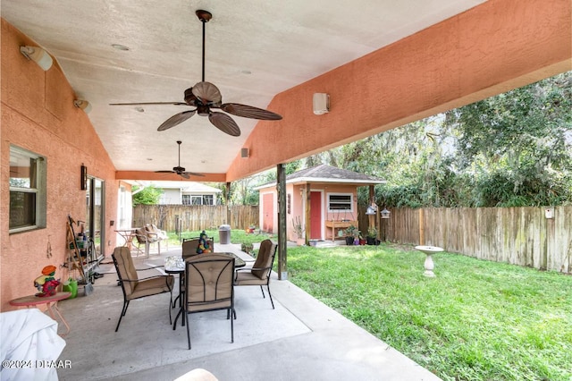 view of patio / terrace featuring ceiling fan and a shed