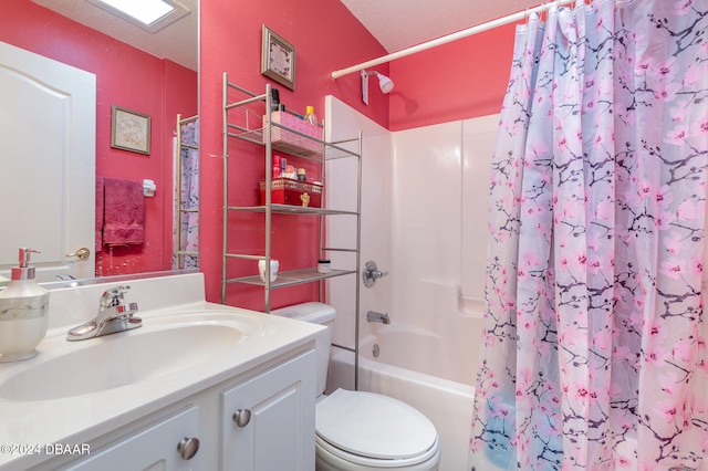 full bathroom featuring shower / bath combo, vanity, a textured ceiling, and toilet