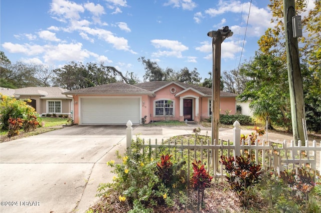 single story home featuring a garage