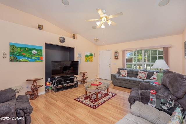 living room with hardwood / wood-style floors, ceiling fan, and vaulted ceiling