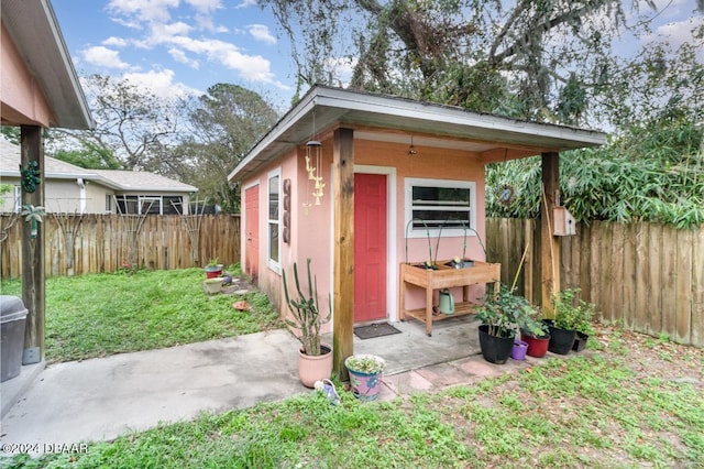 view of outdoor structure with a lawn